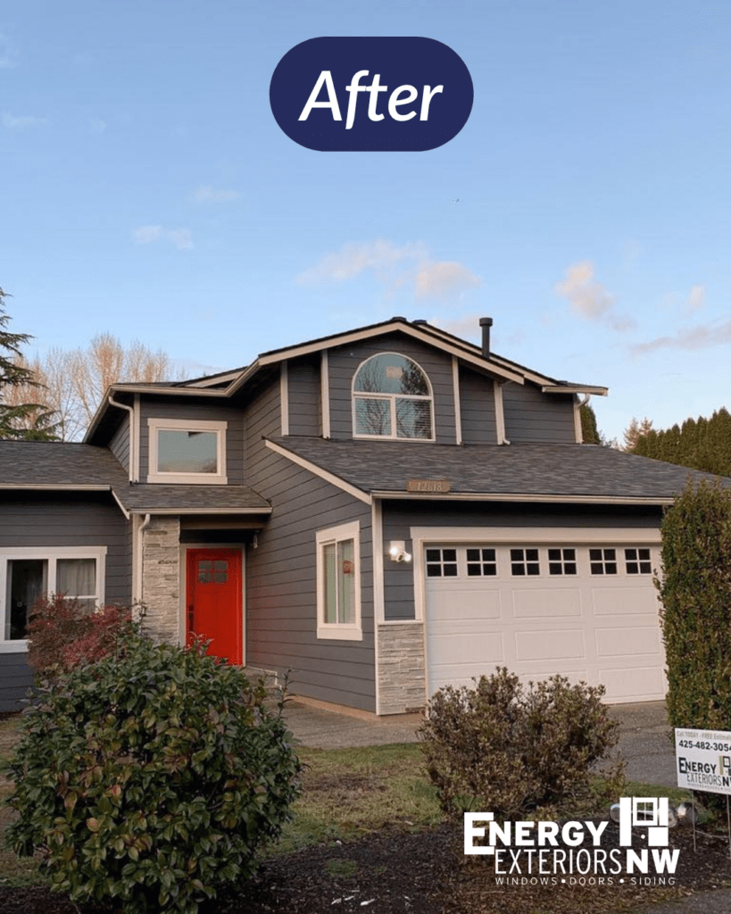 Renovated home with red door and gray siding