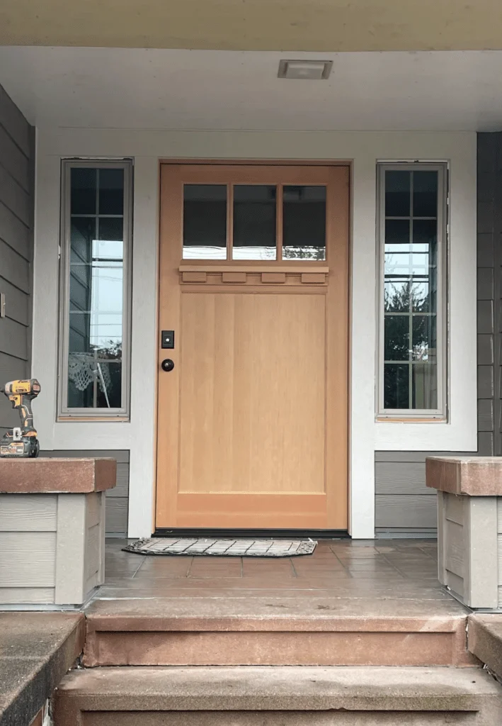 Modern wooden front door with sidelight windows