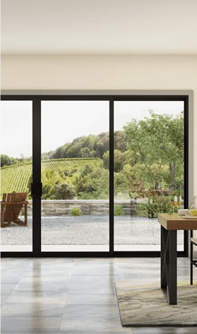 Spacious dining room overlooking lush vineyard through large windows