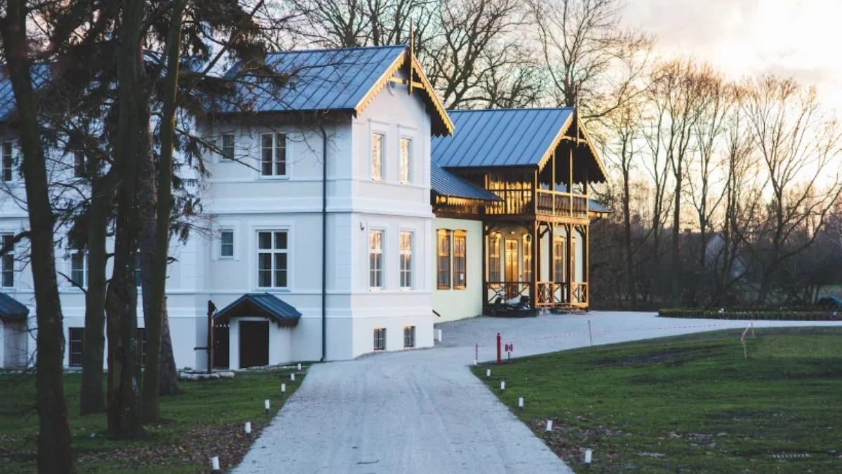 Elegant house with attached gazebo at sunset