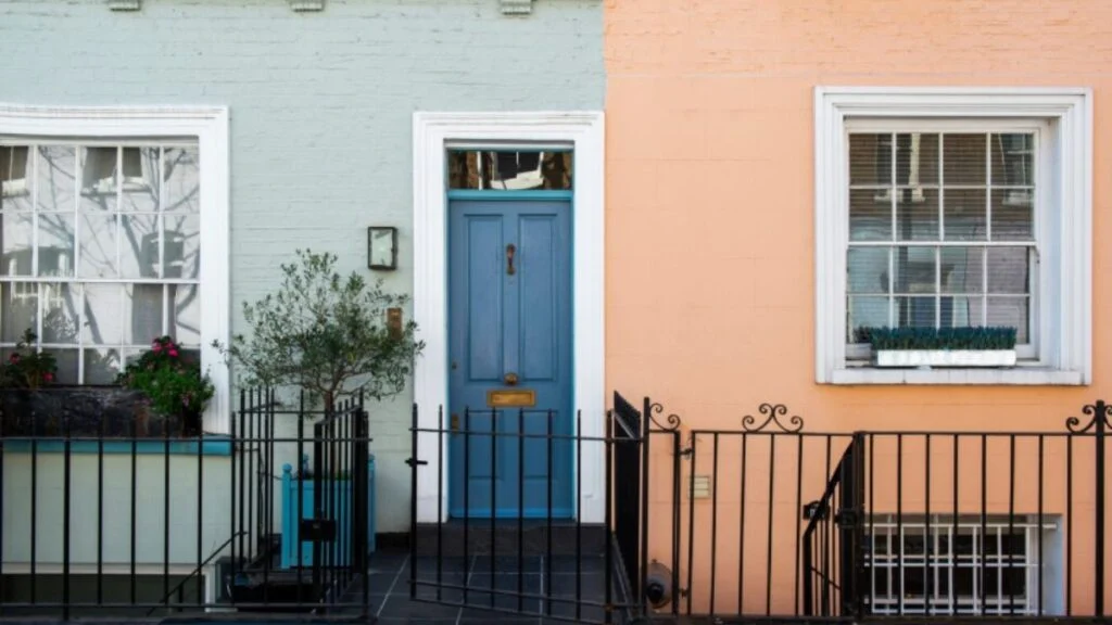 Colorful pastel townhouses with charming front doors